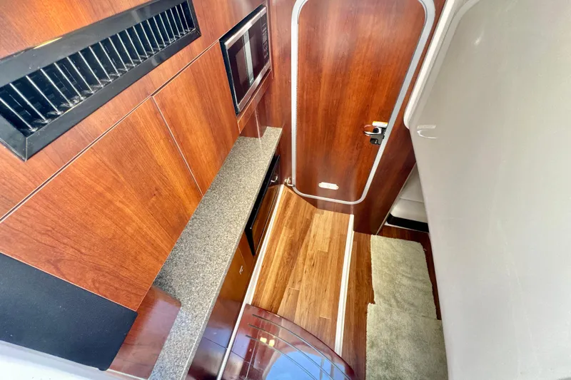  Yacht Photos Pics Interior of 2017 Chaparral 337 SSX boat with wood finish and modern amenities.