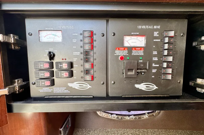  Yacht Photos Pics Electrical control panel of a 2017 Chaparral 337 SSX boat, featuring switches and meters.