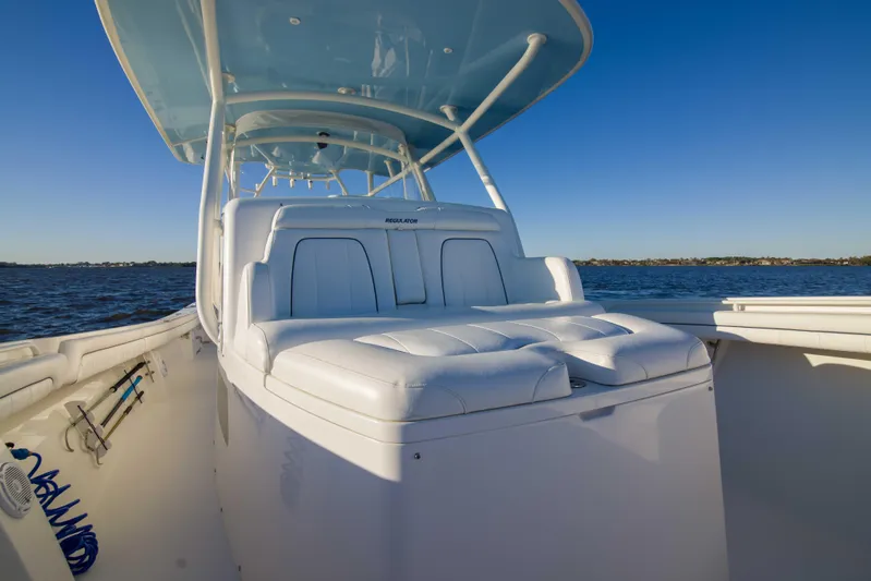 Wound Up II Yacht Photos Pics 2016 Regulator 41 boat with white seating, cruising on calm waters under clear blue skies.
