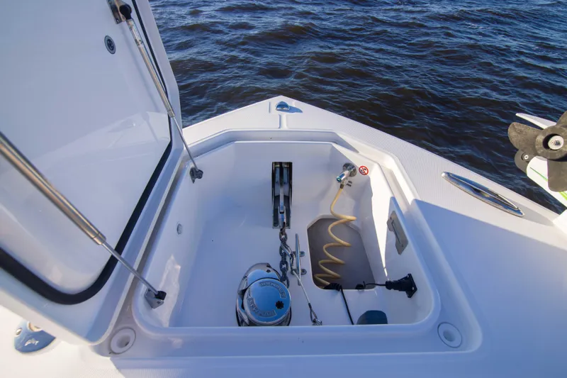 Wound Up II Yacht Photos Pics 2016 Regulator 41 boat anchor locker with equipment, open hatch, and ocean background.
