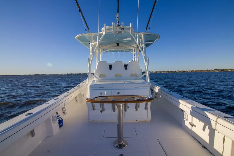 Wound Up II Yacht Photos Pics 2016 Regulator 41 boat on open water, clear sky, spacious deck view.