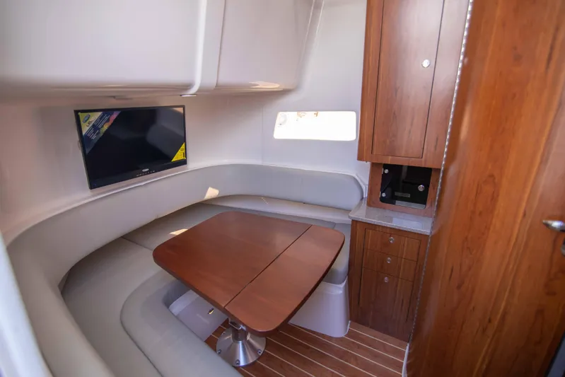 Wound Up II Yacht Photos Pics Luxurious interior of 2016 Regulator 41 boat with wood accents and seating area.