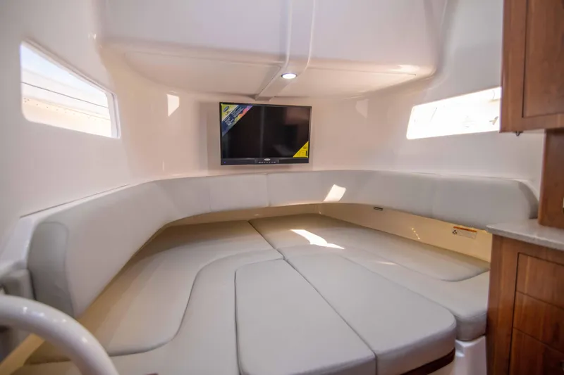 Wound Up II Yacht Photos Pics Luxurious interior of 2016 Regulator 41 boat with seating and TV.