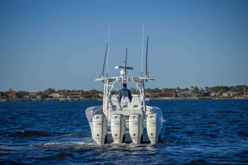 Wound Up II Yacht Photos Pics 2016 Regulator 41 boat cruising on open water with four engines.