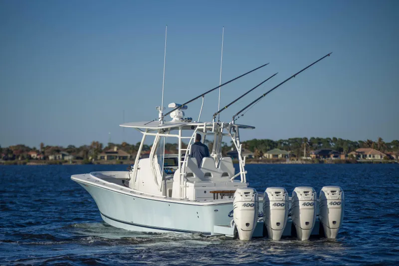 Wound Up II Yacht Photos Pics 2016 Regulator 41 boat with four engines cruising on a calm lake.