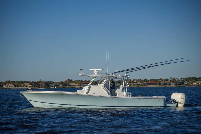 Wound Up II Yacht Photos Pics 2016 Regulator 41 boat cruising on calm waters under clear blue sky.