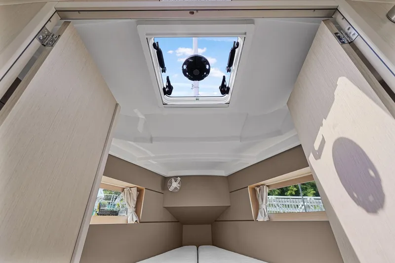 Eugenia Yacht Photos Pics Interior cabin of 2021 Beneteau Oceanis 35.1 yacht with skylight and windows.