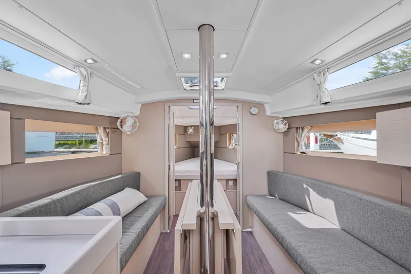 Eugenia Yacht Photos Pics Interior of 2021 Beneteau Oceanis 35.1 yacht, featuring modern seating and natural light.
