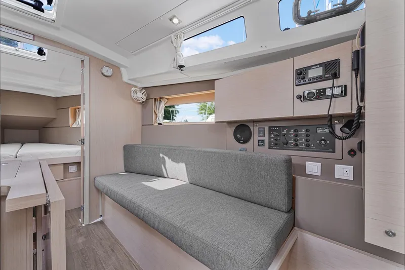 Eugenia Yacht Photos Pics Interior of 2021 Beneteau Oceanis 35.1 yacht with modern seating and control panel.
