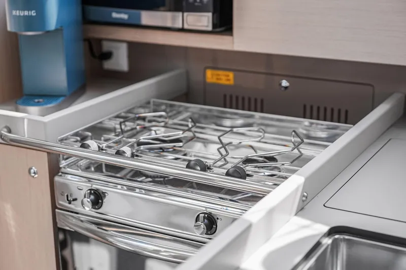 Eugenia Yacht Photos Pics 2021 Beneteau Oceanis 35.1 yacht kitchen with stove and appliances.