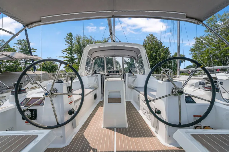 Eugenia Yacht Photos Pics 2021 Beneteau Oceanis 35.1 yacht cockpit with dual steering wheels and modern design.