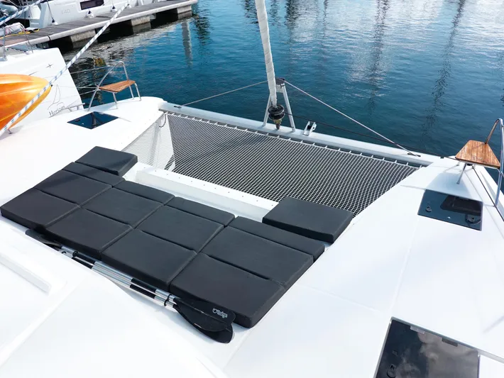 Pegasus Yacht Photos Pics 2022 Fountaine Pajot Astrea 42 catamaran with sunbathing area and netting over water.