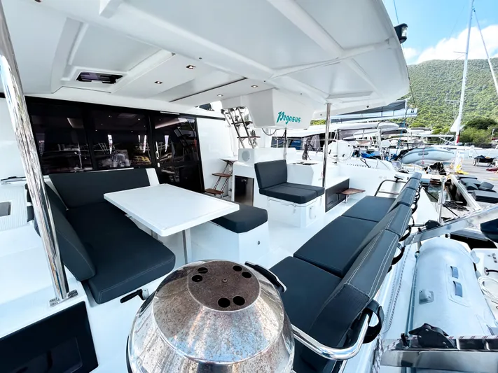 Pegasus Yacht Photos Pics Fountaine Pajot Astrea 42 yacht, 2022 model, featuring spacious outdoor seating and dining area.
