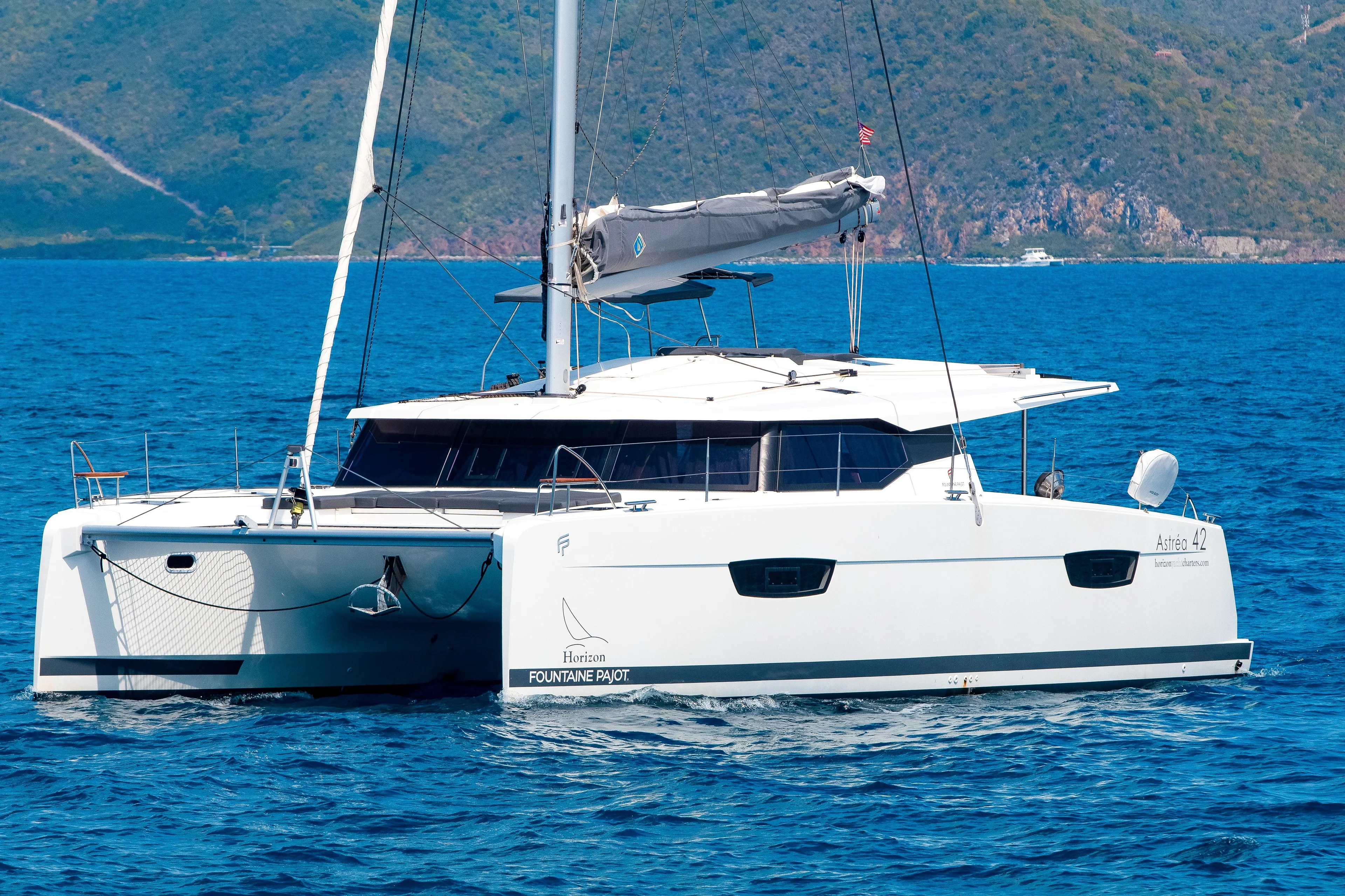 Pegasus Yacht Photos Pics 2022 Fountaine Pajot Astrea 42 catamaran sailing on blue ocean waters.