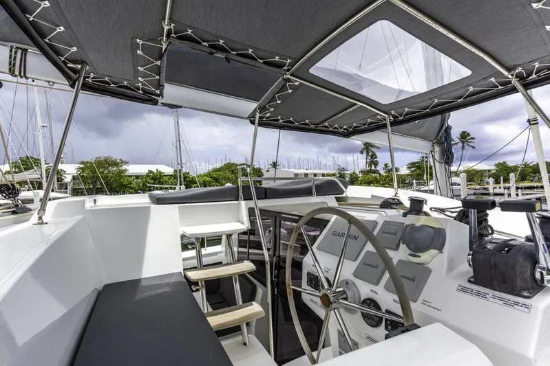 Pegasus Yacht Photos Pics 2022 Fountaine Pajot Astrea 42 yacht cockpit with steering wheel and canopy.