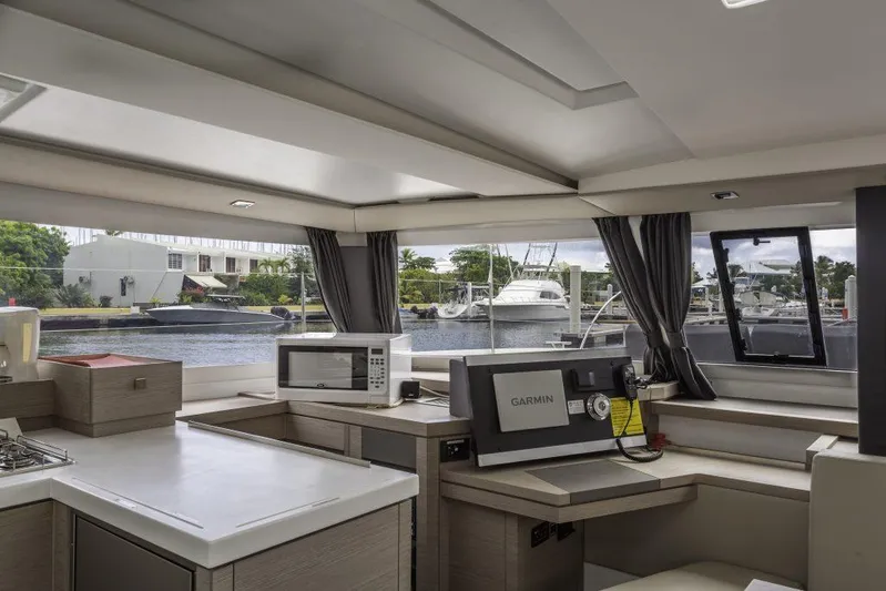 Pegasus Yacht Photos Pics Interior of 2022 Fountaine Pajot Astrea 42 catamaran with modern kitchen and navigation equipment.