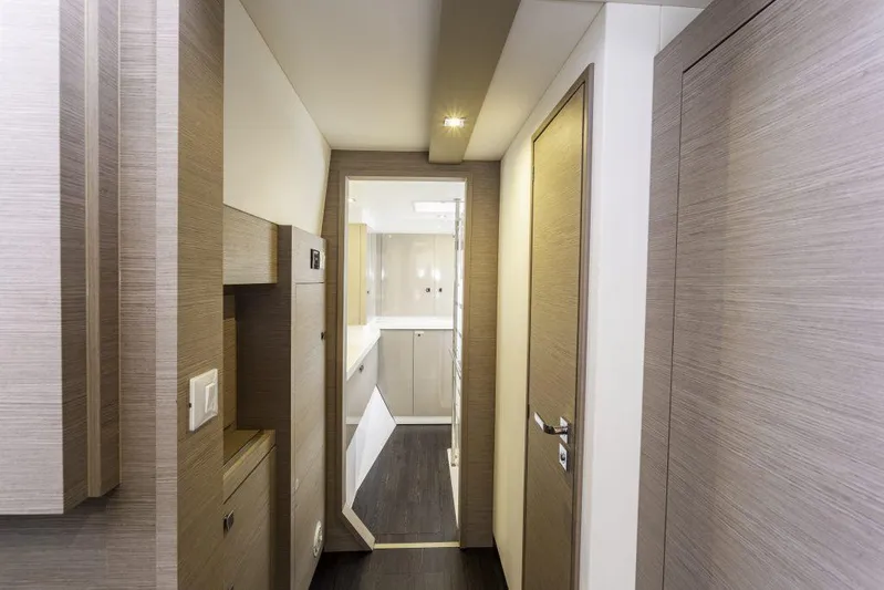 Pegasus Yacht Photos Pics Interior hallway of 2022 Fountaine Pajot Astrea 42 catamaran, featuring modern wood finishes.