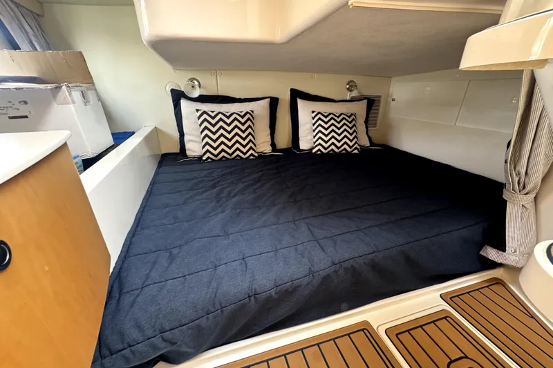  Yacht Photos Pics 2014 Intrepid 400 Cuddy cabin with cozy bed and chevron pillows.