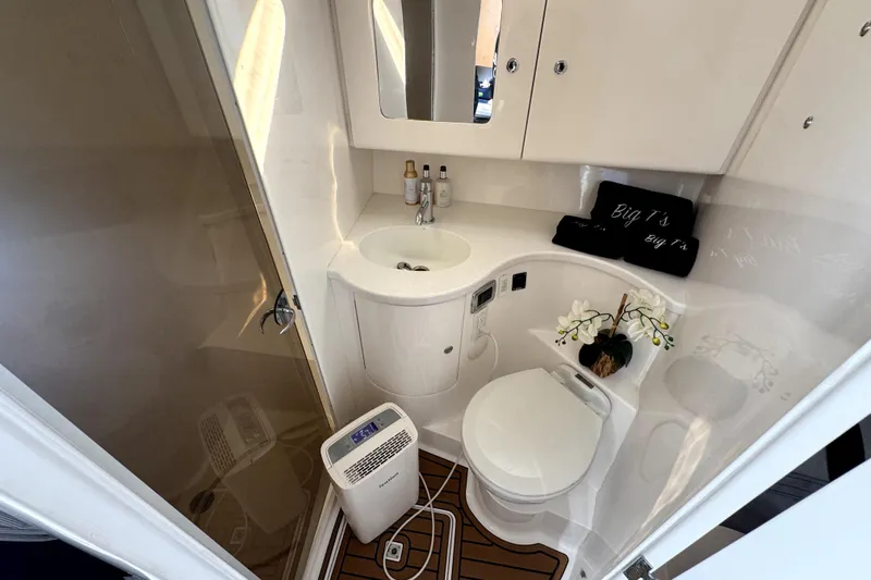  Yacht Photos Pics Luxurious bathroom in 2014 Intrepid 400 Cuddy boat with modern amenities.