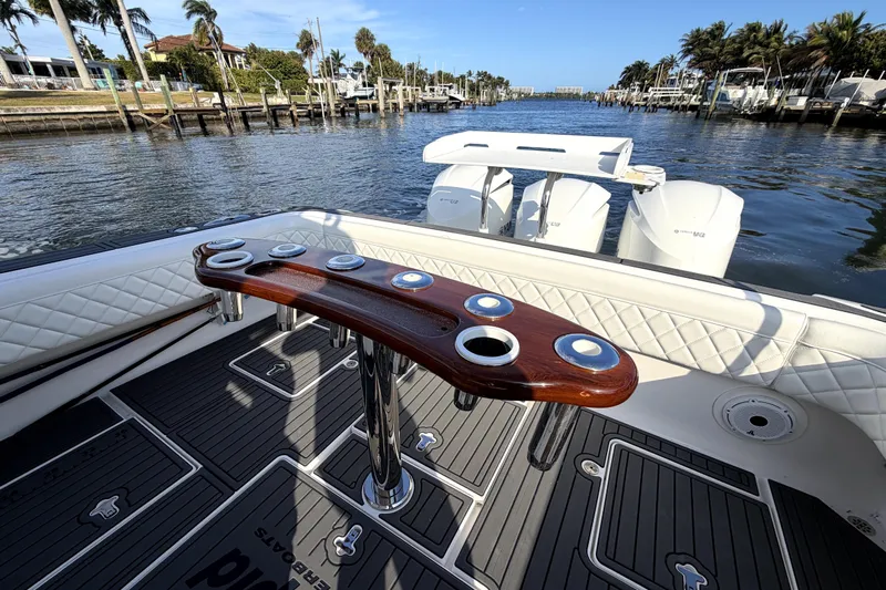  Yacht Photos Pics 2014 Intrepid 400 Cuddy boat with elegant deck and scenic waterfront view.