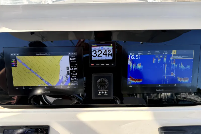  Yacht Photos Pics Garmin navigation and sonar displays on a 2014 Intrepid 400 Cuddy boat dashboard.