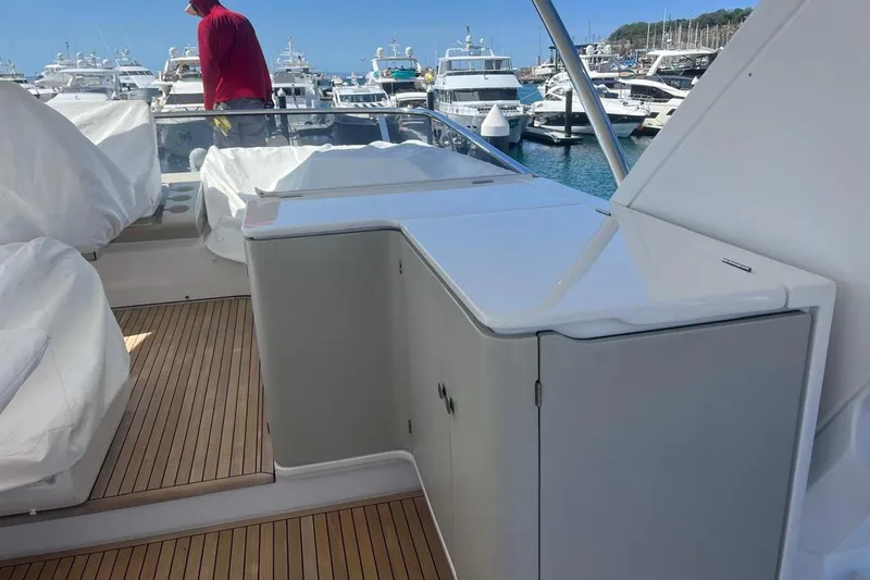 Al&Iacute;a Yacht Photos Pics Azimut Fly 60 yacht deck with sleek cabinetry, docked at a marina, 2025 model.