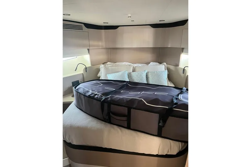 Al&Iacute;a Yacht Photos Pics Luxurious bedroom interior of 2025 Azimut Fly 60 yacht with stylish bedding and modern design.
