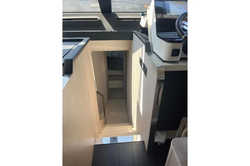 Al&Iacute;a Yacht Photos Pics Interior staircase of 2025 Azimut Fly 60 yacht, featuring modern design and sleek finishes.