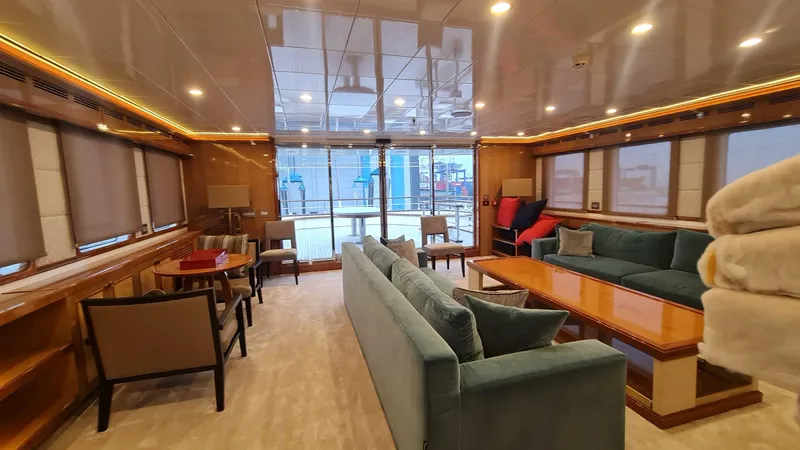  Yacht Photos Pics Luxurious yacht interior with elegant seating, wooden accents, and ambient lighting, Custom 46 M, 2018.