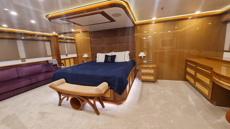  Yacht Photos Pics Luxurious yacht bedroom with elegant wood paneling and ambient lighting, Custom 46 M, 2018 model.