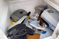 Electric boat motor stored in compartment, featuring ePropulsion branding, on a 2007 Trader 42 model.