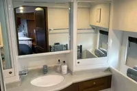 Luxurious bathroom in 2007 Trader 42 yacht with modern fixtures and ample lighting.