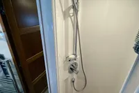 Shower area in 2007 Trader 42 yacht with wooden floor mat.