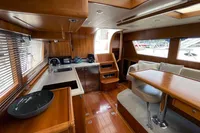 Luxurious interior of a 2007 Trader 42 yacht with wooden finishes and modern amenities.