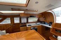 Luxurious 2007 Trader 42 yacht interior with modern kitchen and wooden finishes.