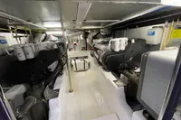 Engine room of a 2007 Trader 42 yacht, showcasing dual engines and mechanical systems.