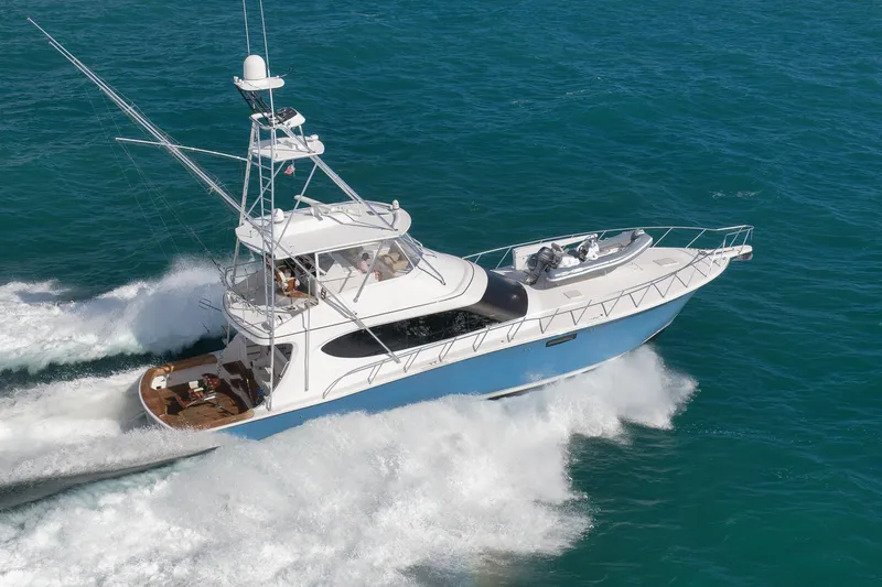 "slim Shady" Yacht Photos Pics 2015 Hatteras GT70 yacht cruising on open blue waters.