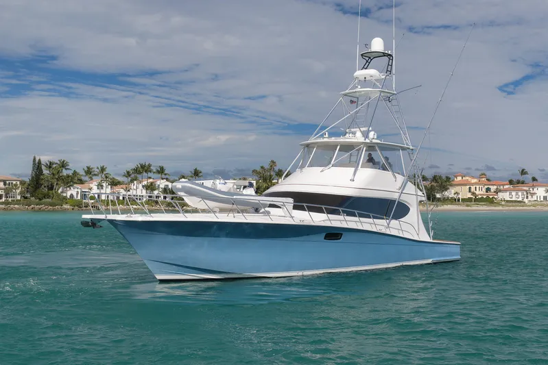 "slim Shady" Yacht Photos Pics 2015 Hatteras GT70 yacht cruising near luxury waterfront homes.