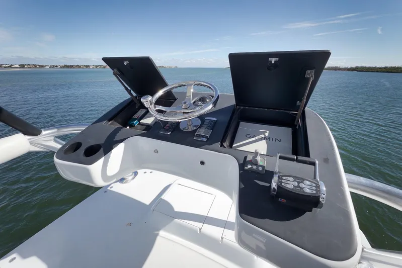 "slim Shady" Yacht Photos Pics Helm of 2015 Hatteras GT70 yacht with Garmin navigation system on open water.