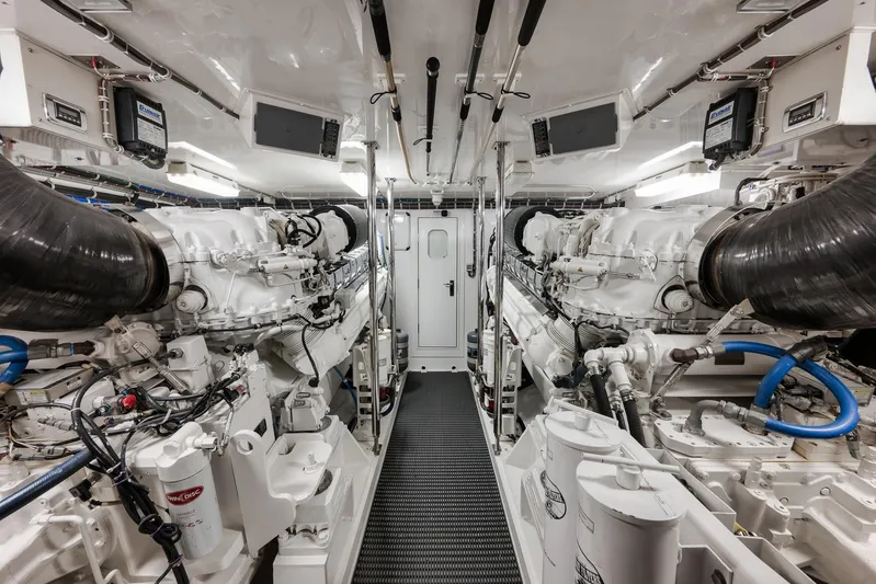 "slim Shady" Yacht Photos Pics Engine room of 2015 Hatteras GT70 yacht, featuring dual engines and advanced equipment.