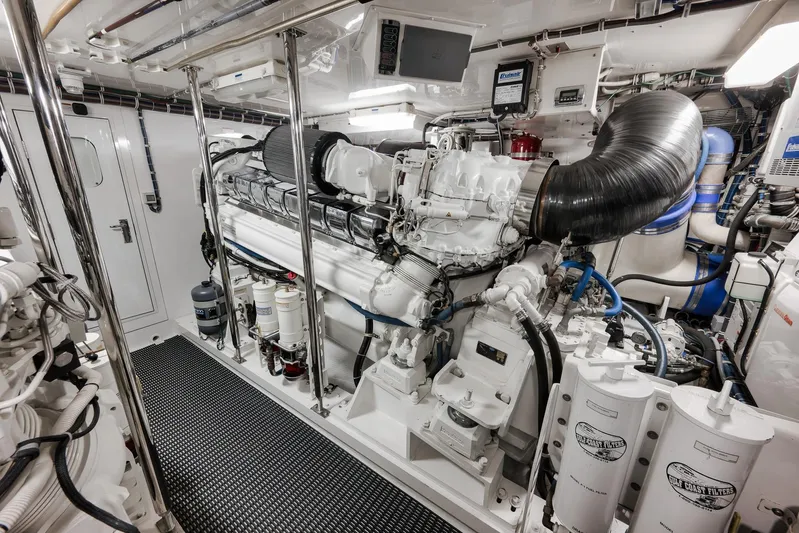 "slim Shady" Yacht Photos Pics Engine room of 2015 Hatteras GT70 yacht, featuring advanced machinery and equipment.