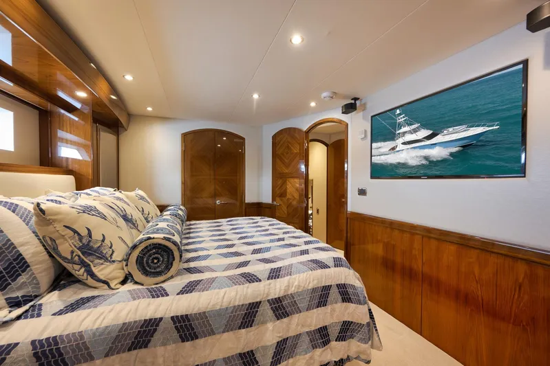 "slim Shady" Yacht Photos Pics Luxurious 2015 Hatteras GT70 yacht bedroom with elegant wood finishes and nautical decor.