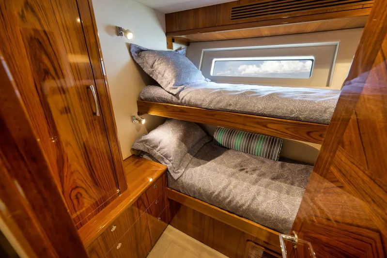 "slim Shady" Yacht Photos Pics Luxurious wooden interior of 2015 Hatteras GT70 yacht with cozy bunk beds.