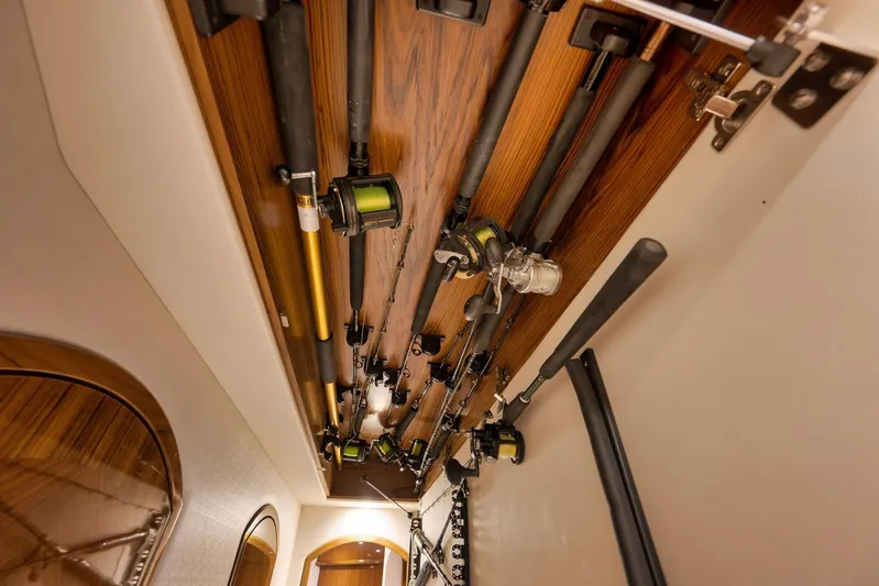 "slim Shady" Yacht Photos Pics Fishing rods stored on a 2015 Hatteras GT70 yacht's wooden ceiling rack.
