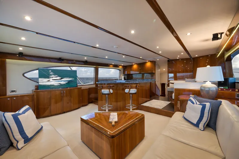 "slim Shady" Yacht Photos Pics Luxurious interior of 2015 Hatteras GT70 yacht with elegant wood finishes and modern amenities.