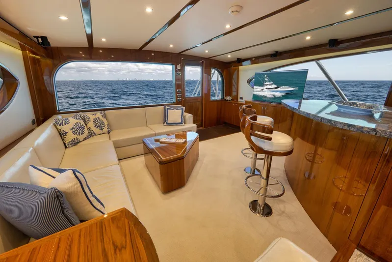 "slim Shady" Yacht Photos Pics Luxurious interior of 2015 Hatteras GT70 yacht with ocean view and elegant seating area.