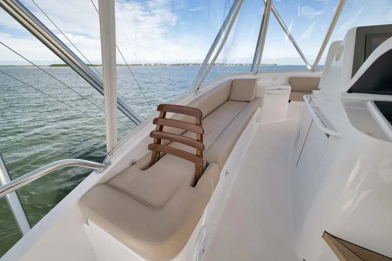 "slim Shady" Yacht Photos Pics Luxurious interior of 2015 Hatteras GT70 yacht with comfortable seating and panoramic views.