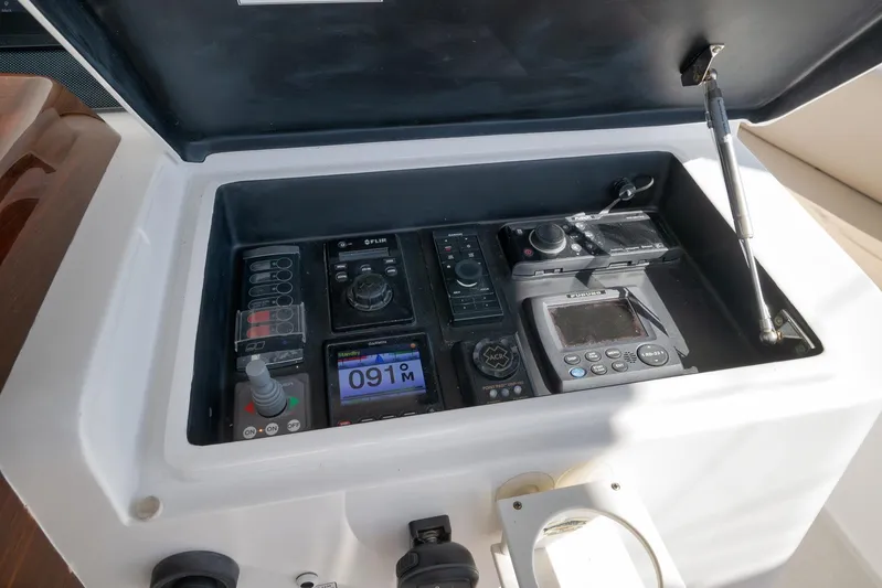 "slim Shady" Yacht Photos Pics Control panel of a 2015 Hatteras GT70 yacht with navigation and communication equipment.
