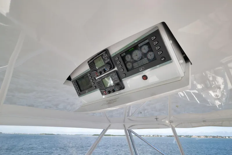 "slim Shady" Yacht Photos Pics Control panel of 2015 Hatteras GT70 yacht, featuring navigation and monitoring instruments.
