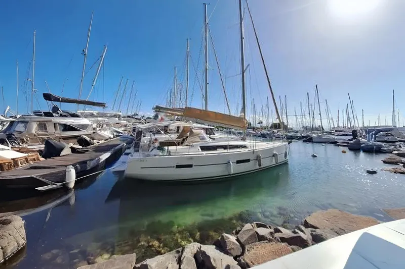 Bermuda Yacht Photos Pics 2017 Dufour 412 Grand Large sailboat docked in a sunny marina.